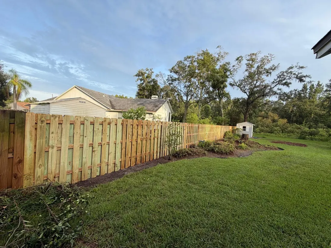 Wood fence section along a property line