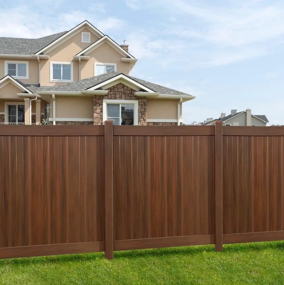 Brown wood-grain vinyl privacy fence example