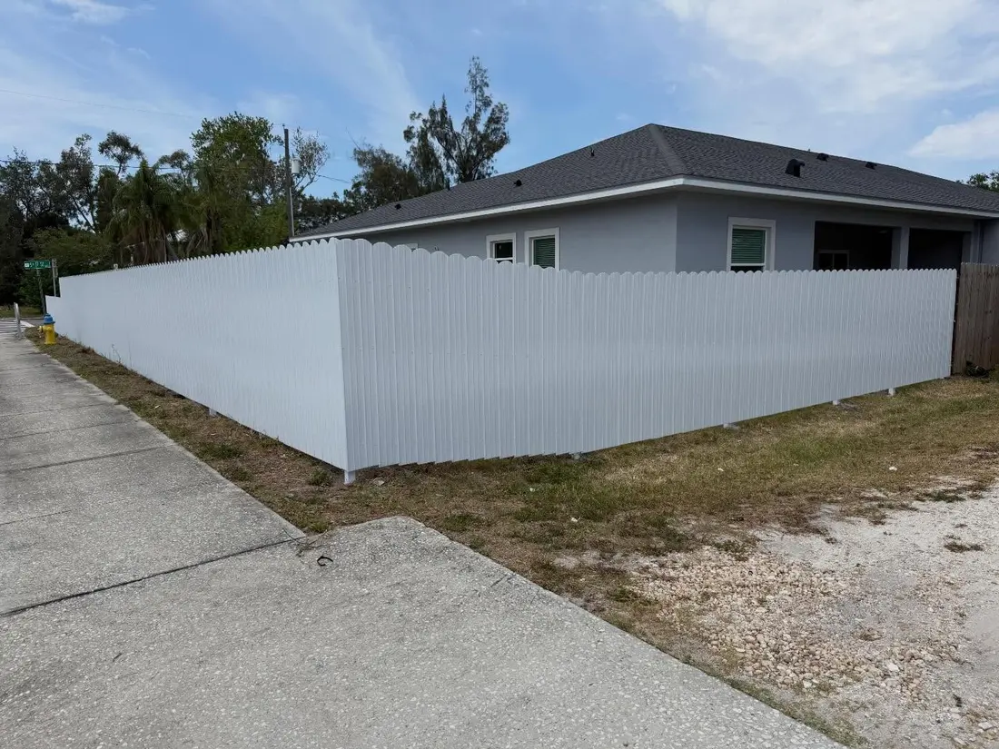 White vinyl privacy fence on a corner lot