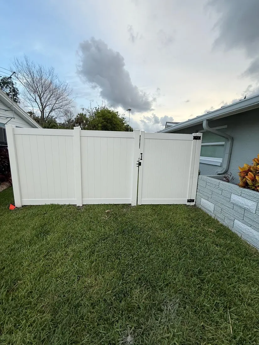 Vinyl fence and gate installation in progress