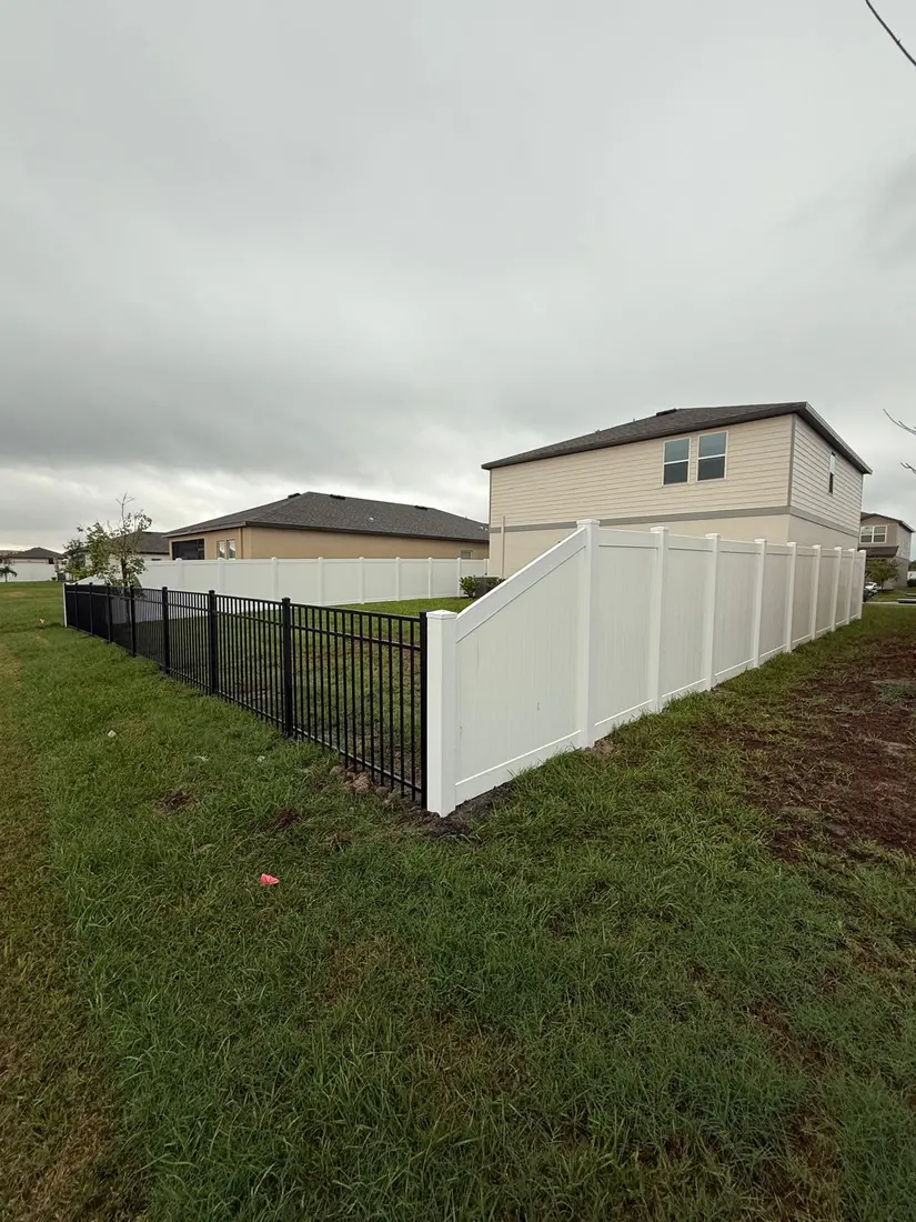 White vinyl privacy fence and gate detail